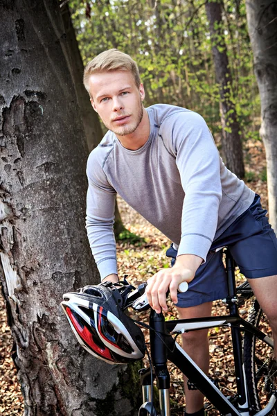 Sportsman riding bicycle — Stock Photo, Image