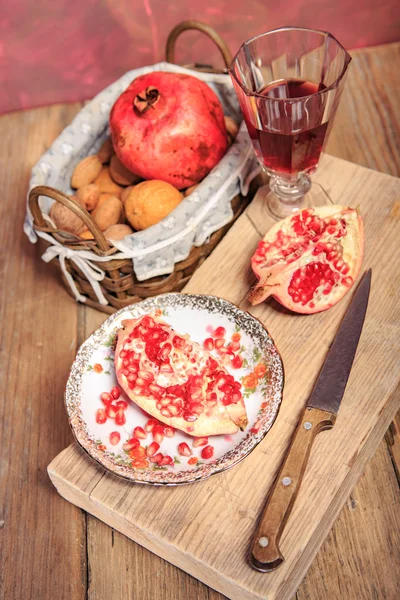 Pomegranate and nuts — Stock Photo, Image