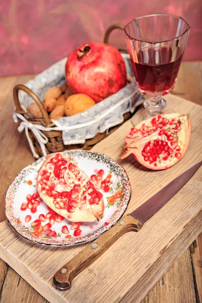 Pomegranate and nuts — Stock Photo, Image