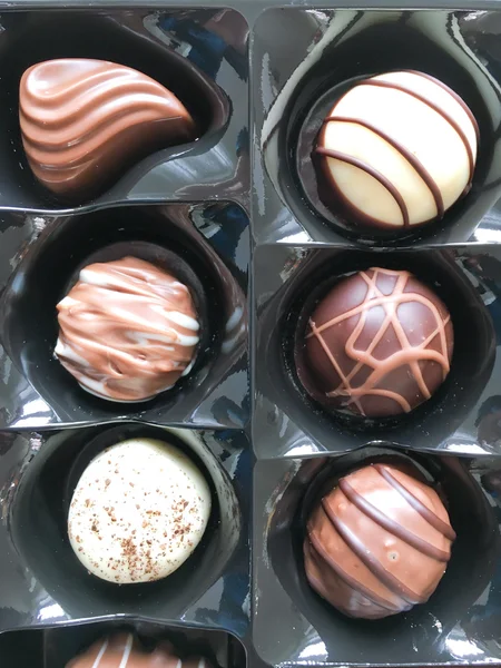 Chocolates selection in a tray — Stock Photo, Image