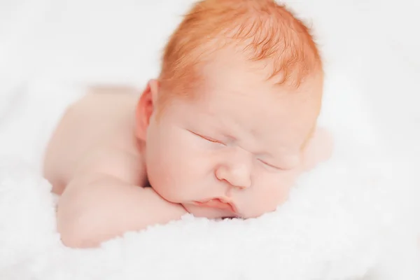 Sleeping newborn baby in a wrap — Stock Photo, Image