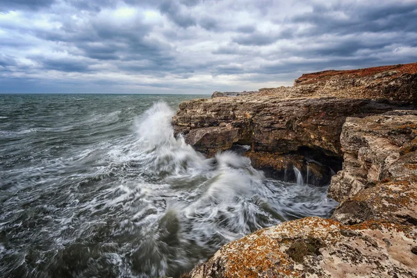 Dramatic seascape with rocks and waves Stock Picture