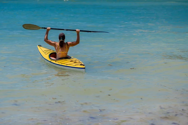 Young woman kayaking in the sea — Stock Photo, Image