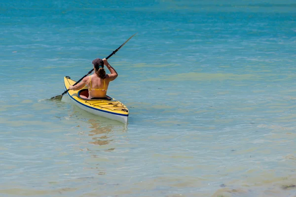 Young woman kayaking in the sea — Stock Photo, Image