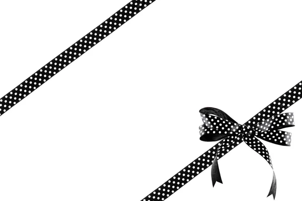 Černá a bílá stuha s lukem na bílém pozadí — Stock fotografie