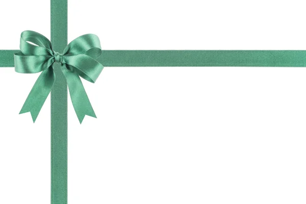 Green ribbon with a bow on white background — Stock Photo, Image