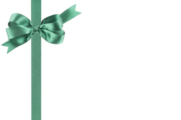 Green ribbon with a bow on white background — Stock Photo, Image