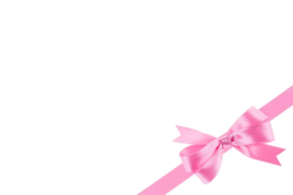 Pink ribbon with a bow on white background — Stock Photo, Image