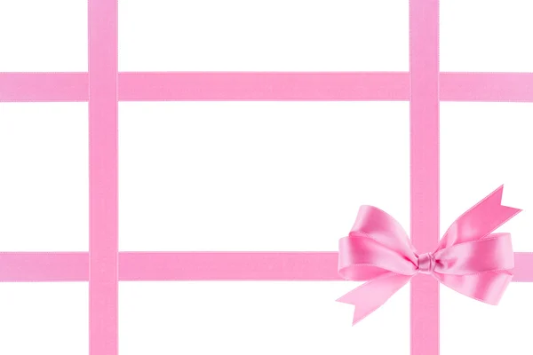 Pink ribbon with a bow on white background — Stock Photo, Image