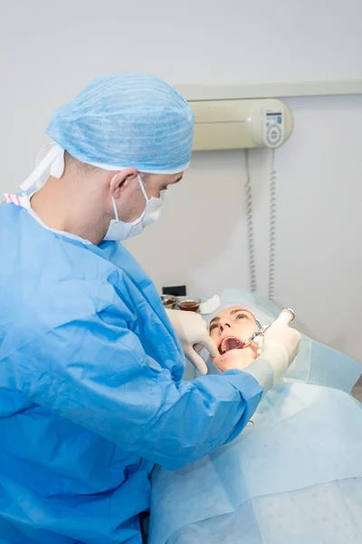 Dentists during surgery for implant placement — Stock Photo, Image