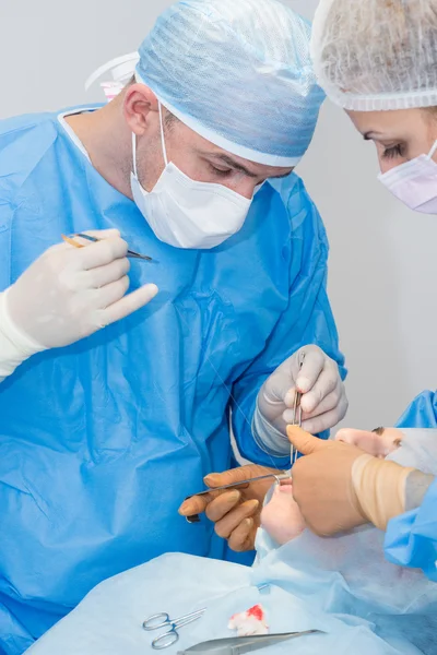 Dentists during surgery for implant placement — Stock Photo, Image