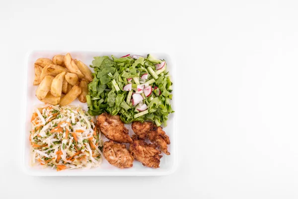 fried chicken with salad and potatoes - copy space