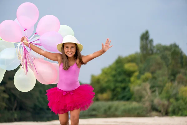 Little girl with baloons — Stock Photo, Image