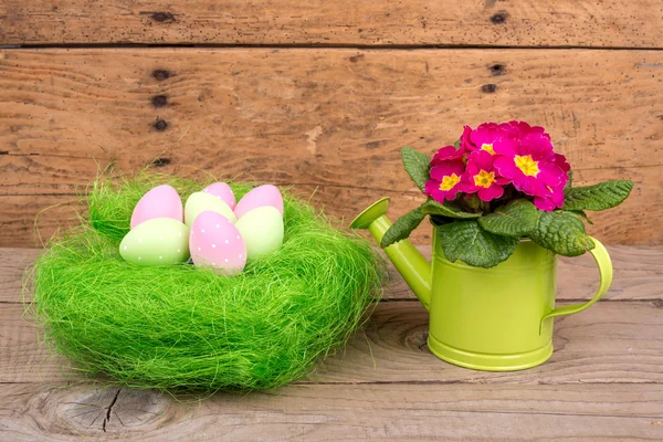 Easter eggs over wooden table — Stock Photo, Image