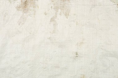 Kirli beyaz örülmüş plastik torba dokusu. Polipropilen çuval bezi yüzeyi.