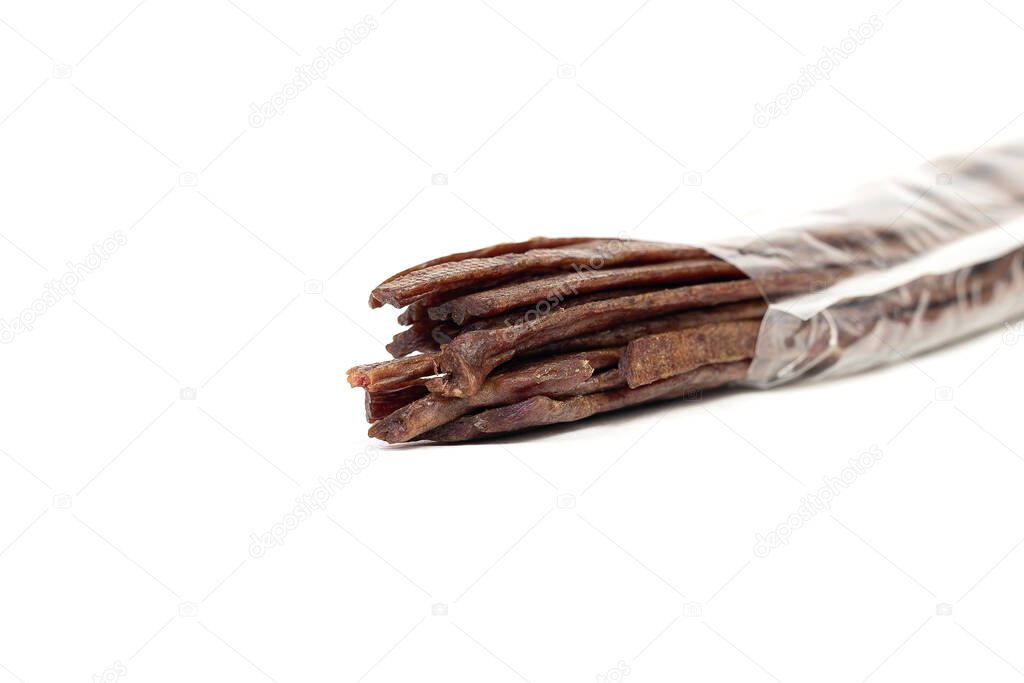 Packaging Dried beef meat sliced on stick, beer snack isolated on white background