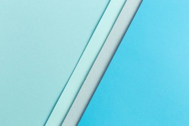 Malzeme tasarımı mavi arkaplan. Kağıt kağıtlar farklı şekillerde katlanır. Bir fotoğraf.