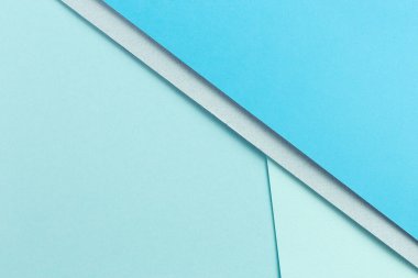 Malzeme tasarımı mavi arkaplan. Kağıt kağıtlar farklı şekillerde katlanır. Bir fotoğraf.
