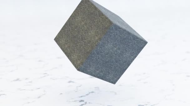 Een kubus steen verbrijzelt in duizenden kleine stukjes in slow motion. Vernietigingsconcept — Stockvideo