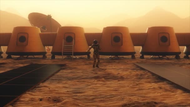 Astronauta en el planeta Marte realizando un baile en su base. Pequeña tormenta de polvo. La antena parabólica envía datos al suelo. Animación 3D realista — Vídeos de Stock