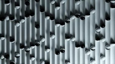 Yol boyunca yuvarlanan toplarla dolu parlak renkli bir arka plan. Plastik top geometriyi derinleştiriyor. Kusursuz bir döngünün 3d animasyonu