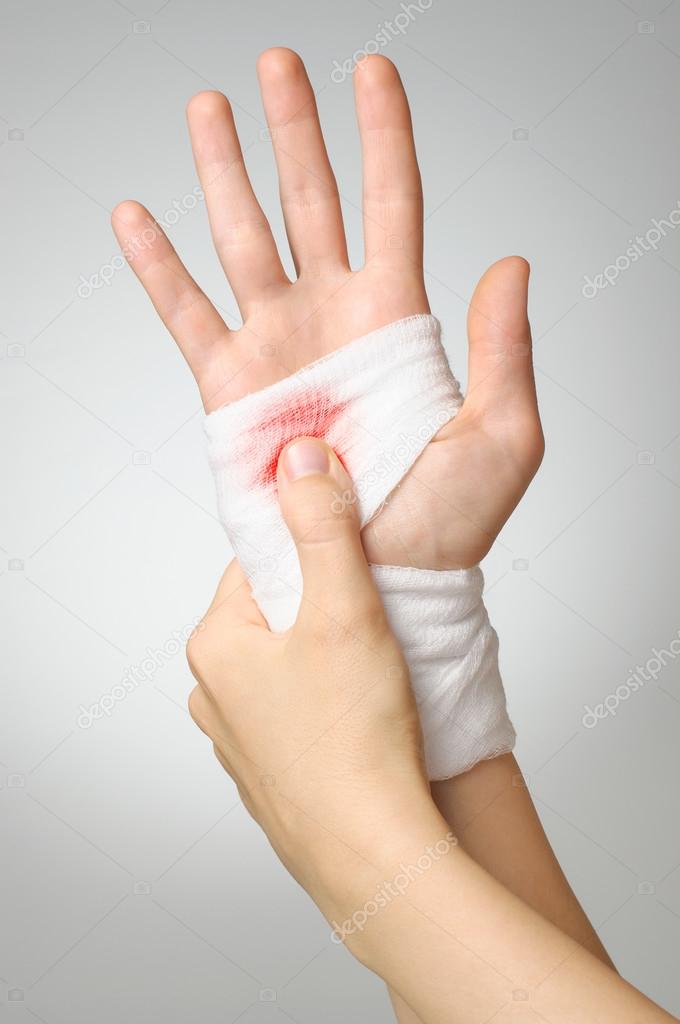 Injured hand with bloody bandage