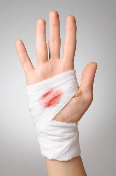 Hand with bloody bandage — Stock Photo, Image