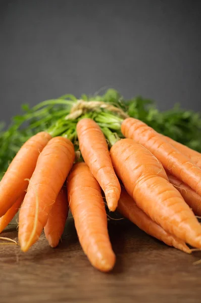 Fresh carrots on wooden table — Stock Photo, Image