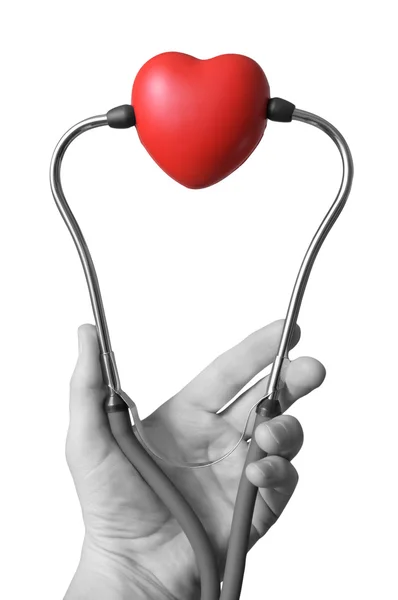 Main avec stéthoscope et coeur — Photo