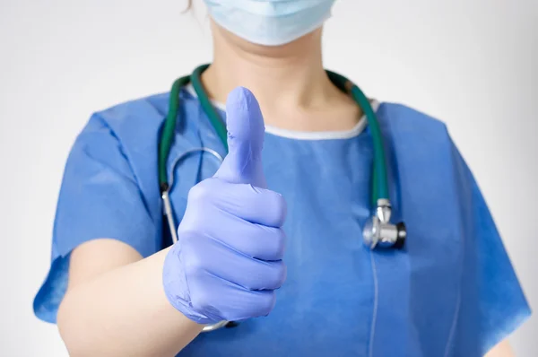 Doctor with thumbs up gesture — стоковое фото
