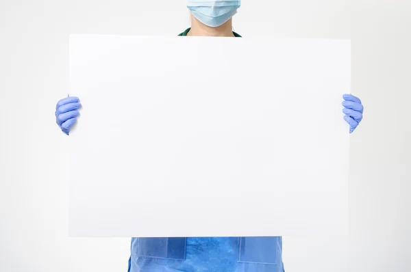Doctor holding blank board — Stock Photo, Image