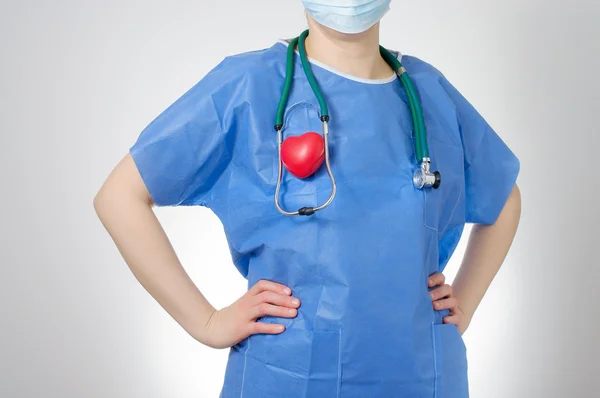 Doctor with red heart shape — Stock Photo, Image