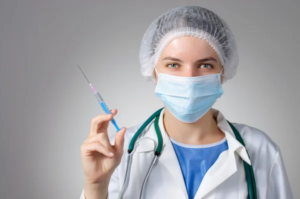 Female doctor with syringe — Stock Photo, Image