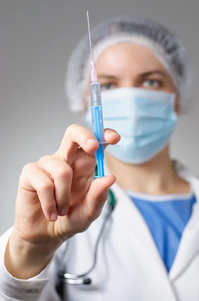 Female doctor with syringe — Stock Photo, Image