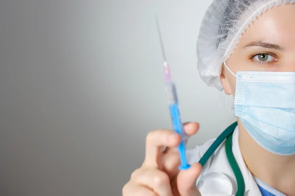 Female doctor with syringe — Stock Photo, Image