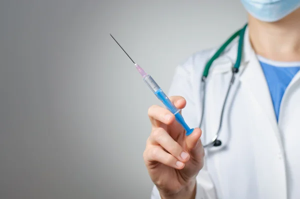 Female doctor with syringe — Stock Photo, Image