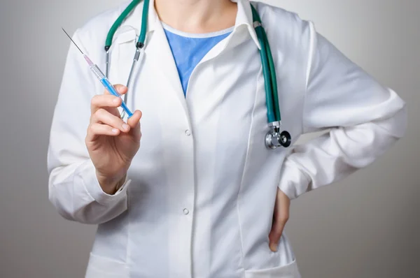 Female doctor with syringe Royalty Free Stock Photos