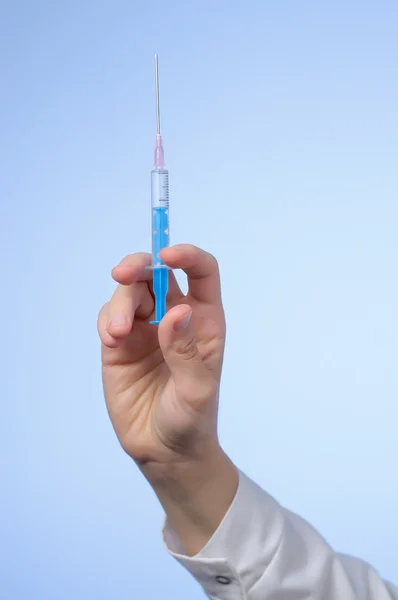 Doctor's hand with syringe — Stock Photo, Image