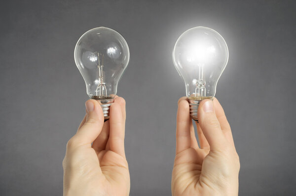 Decision making concept, hands with light bulbs