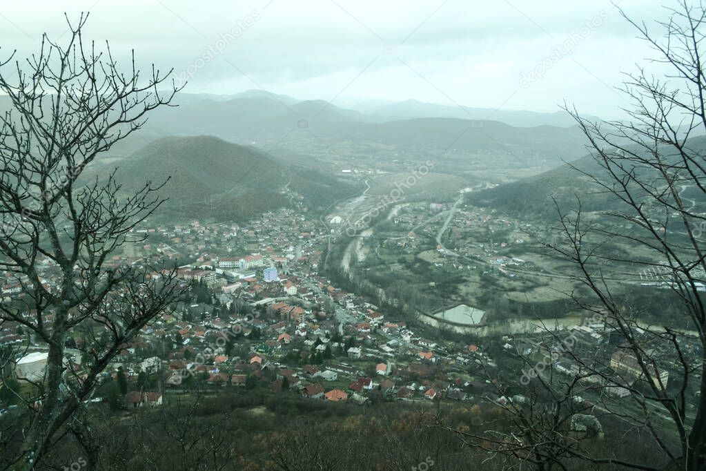 Panorama of the city of Zvecan, in the northern part of Kosovo, with a serb majority of population, in winter, with the mountain range of Ibarski Kolasin and the ibar river