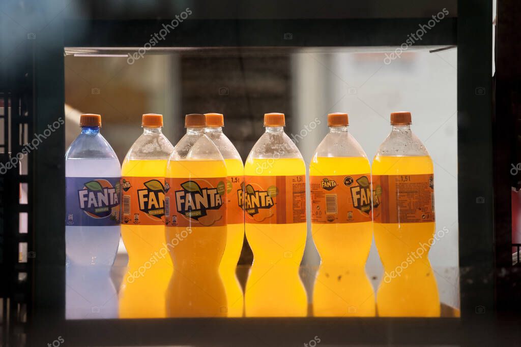BELGRADE, SERBIA - JUNE 6, 2019: Logo of  Fanta on bottles of Orange and Shokata (blue) for sale in Belgrade. Fanta is a german brand of orange soda carbonated soft drinks