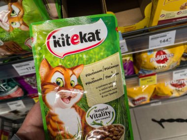 BELGRADE, SERBIA - MARCH 2, 2021: Kitekat logo on a pack of canned cat wet food for sale. Part of Pedigree, kitekat is an american brand of feline cat food spread worldwide