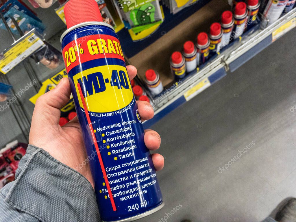 BELGRADE, SERBIA - MARCH 21 2021: WD 40 logo on some of their water displacer sprays for sale in Belgrade. WD-40 is an iconic American brand of chemicals used to unstuck and loosen