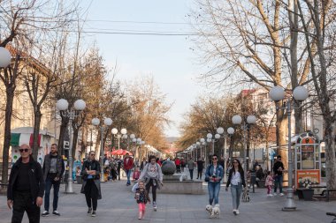 LAZAREVAC, SERBIA - APRIL 10, 2021: Crowd of People walking on the main pedestrain street of Karadjordjeva ulica in the center of Lazarevac, a major city of Kolubara district, part of Belgrade clipart