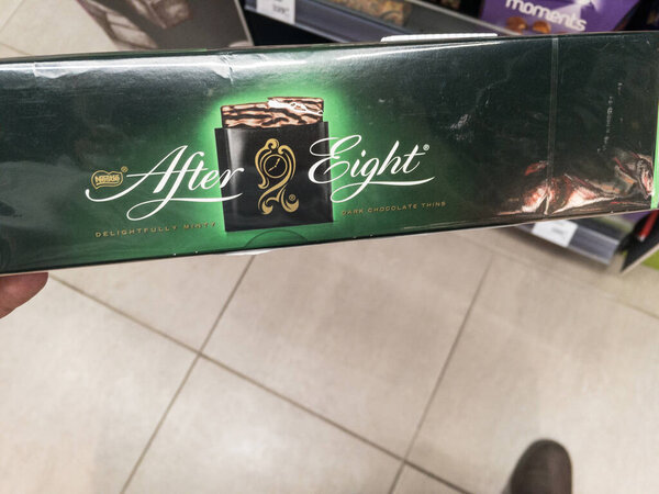 BELGRADE, SERBIA - JUNE 12, 2021: Selective blur on a box of After Eights for sale in Belgrade. After Eight Mint Chocolate Thins are a brand owned by nestle of mint chocolates.