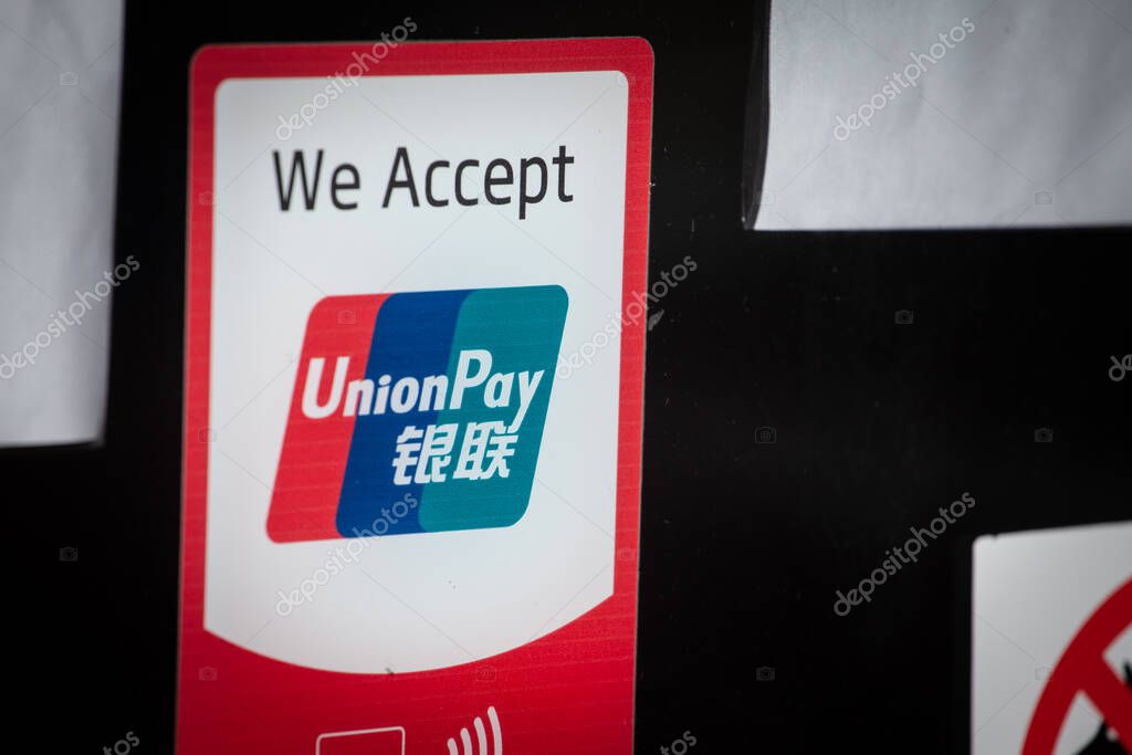 BELGRADE, SERBIA - AUGUST 10, 2025: sticker We Accept UnionPay with UnionPay logo on a payment acceptance sign in Belgrade. UnionPay is a a Chinese financial services corporation issuing bank cards.