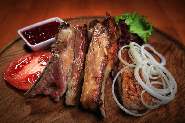 Lamb ribs on wooden board — Stock Photo, Image