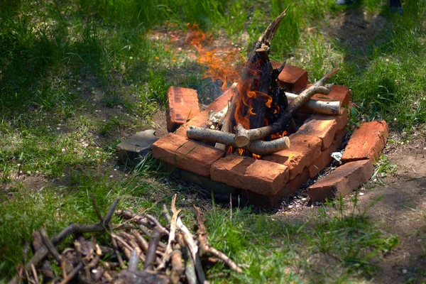 Homemade barbecue in nature, for cooking barbecue and other meat on fire, coals, in a clearing among trees