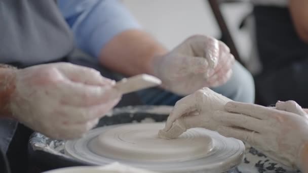 Close-up of a male master working on a potters wheel close-up in slow motion — Stock Video