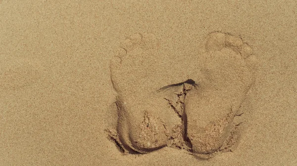 Footprints on the sand background — Stock Photo, Image